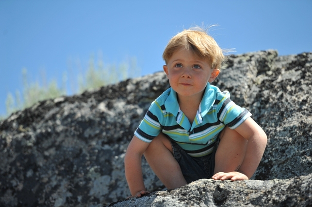 Adorable Kaeden on boulder at BoulderCrest Ranch