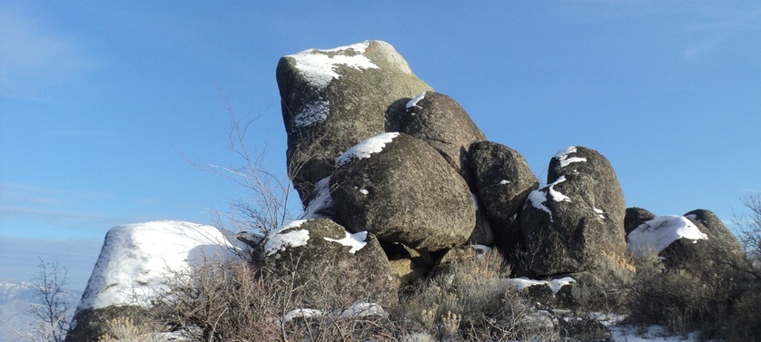 Snow falls on boulders at BoulderCrest Ranch